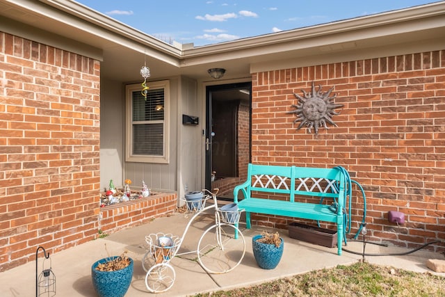 doorway to property with a patio area