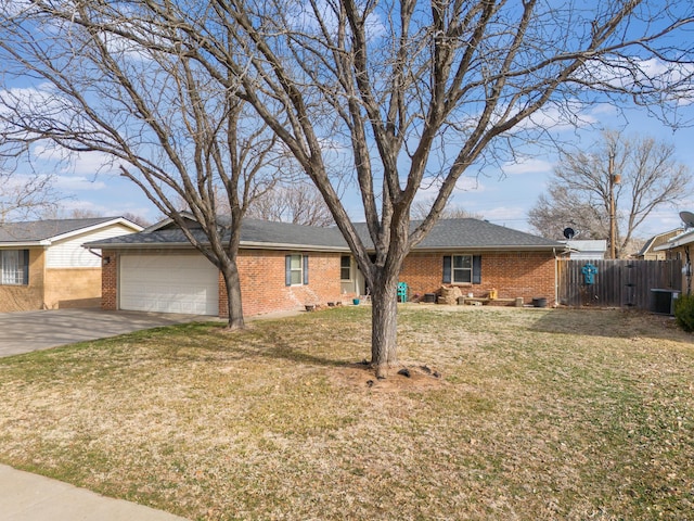 ranch-style house featuring a garage and a front yard