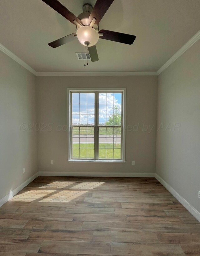 7504 Limestone Dr, Amarillo, TX 79119 - empty room featuring crown molding, baseboards, a ceiling fan, and wood finished floors
