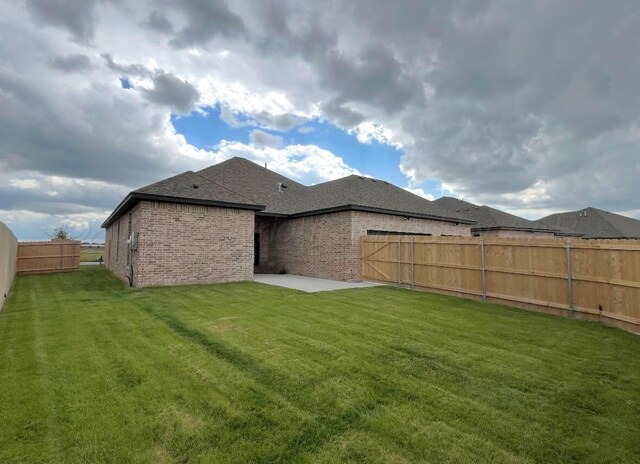 7504 Limestone Dr, Amarillo, TX 79119 - ranch-style home with brick siding, a front yard, and roof with shingles