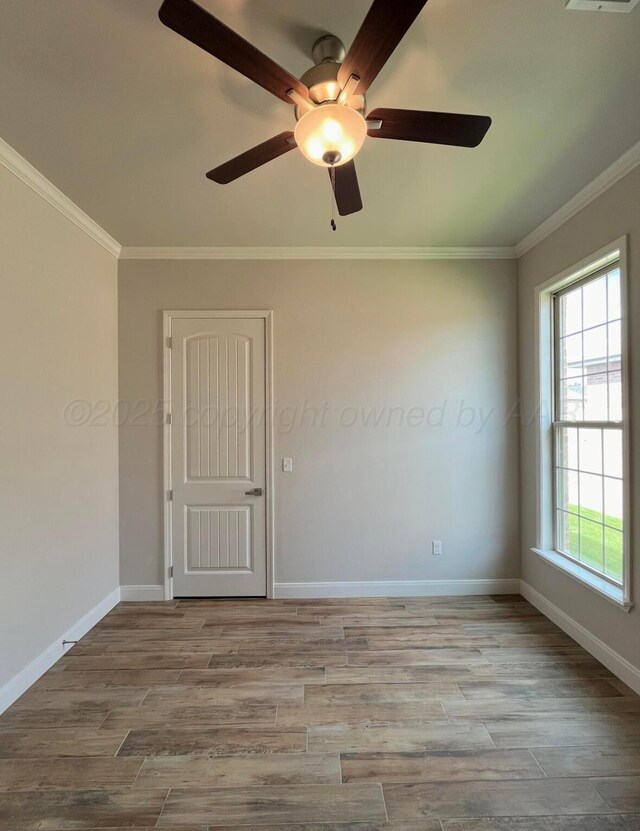 7504 Limestone Dr, Amarillo, TX 79119 - spare room with crown molding, wood finished floors, baseboards, and ceiling fan