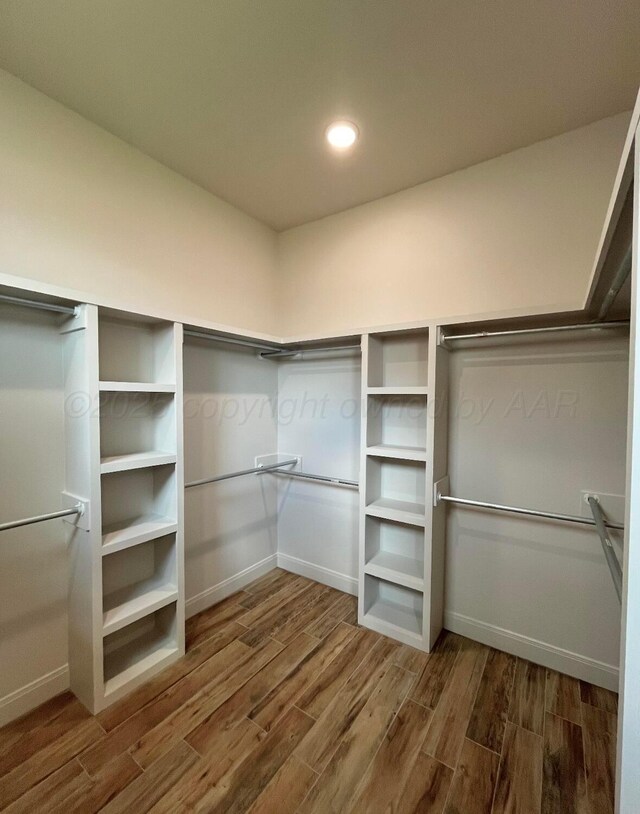 7504 Limestone Dr, Amarillo, TX 79119 - walk in closet with wood finished floors