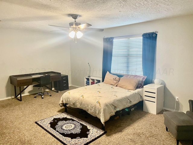813 Tranquility Ln, Borger, TX 79007 - carpeted bedroom with a textured ceiling, baseboards, and a ceiling fan