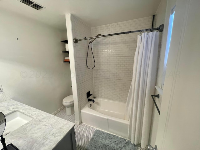 bathroom with vanity, toilet, visible vents, tile patterned flooring, and shower / bath combination with curtain