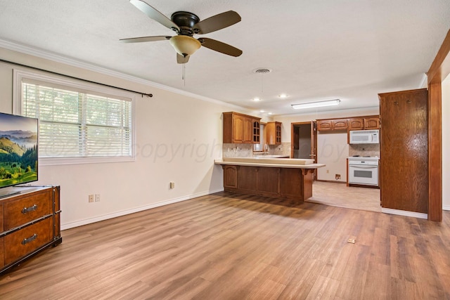 624 Nara Visa Ln, Fritch, TX 79036 - kitchen with white appliances, a peninsula, light wood-style flooring, ornamental molding, and backsplash