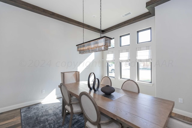 dining space featuring visible vents, baseboards, a wealth of natural light, and dark wood-style flooring