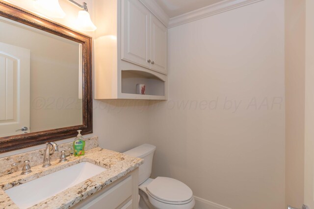 7901 Kingsgate Dr, Amarillo, TX 79119 - half bathroom featuring vanity and ornamental molding