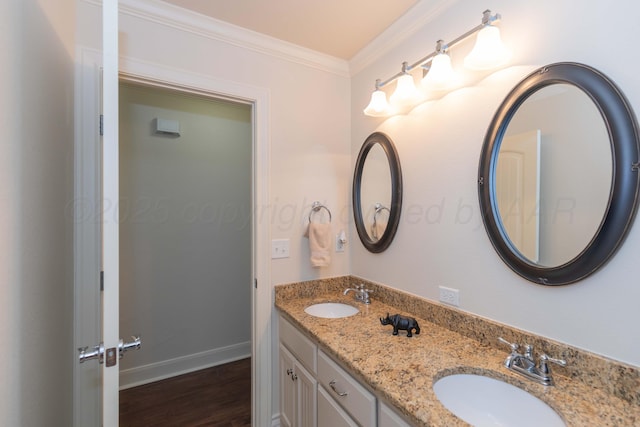 7901 Kingsgate Dr, Amarillo, TX 79119 - full bathroom featuring double vanity, wood finished floors, and ornamental molding