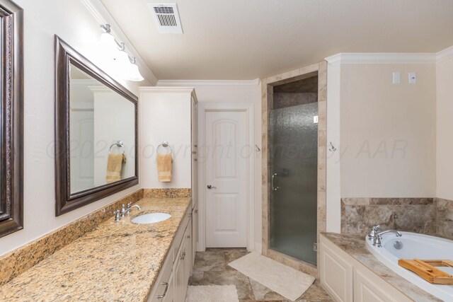 7901 Kingsgate Dr, Amarillo, TX 79119 - bathroom featuring a shower stall, vanity, a bath, and ornamental molding