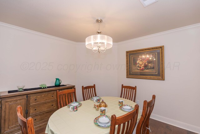 7901 Kingsgate Dr, Amarillo, TX 79119 - dining area with a chandelier, crown molding, and dark wood-style flooring