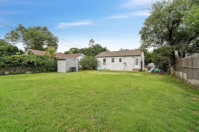 4621 Crockett St, Amarillo, TX 79110 - fenced backyard featuring entry steps and a storage unit