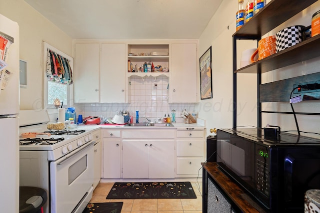4621 Crockett St, Amarillo, TX 79110 - kitchen featuring white appliances, open shelves, light countertops, light tile patterned floors, and backsplash