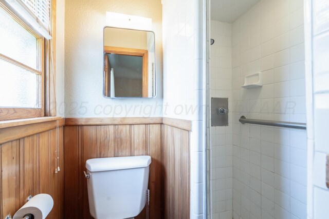 3320 Paramount Blvd, Amarillo, TX 79109 - full bath featuring a wainscoted wall, a stall shower, and toilet