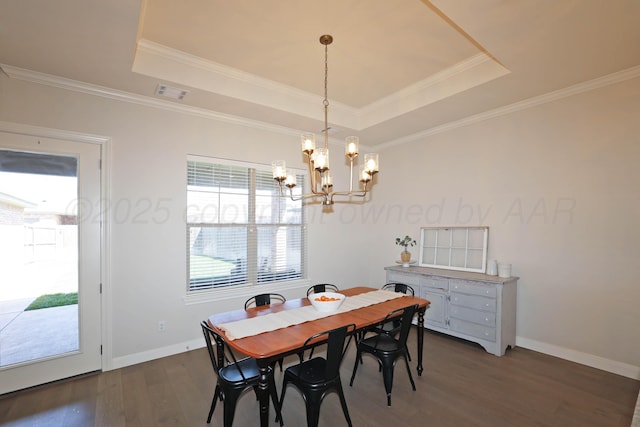 6107 Bowery, Amarillo, TX 79119 - dining space with a tray ceiling, a chandelier, dark wood-style floors, baseboards, and crown molding