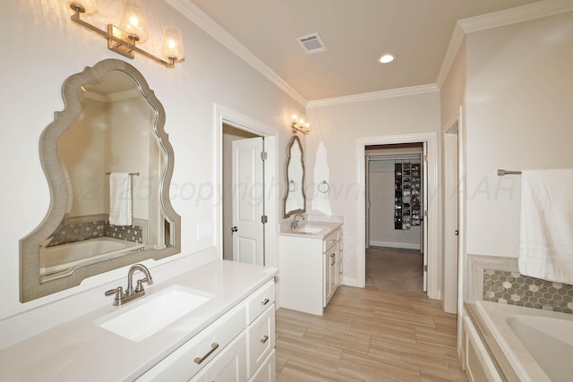 6107 Bowery, Amarillo, TX 79119 - full bath with two vanities, crown molding, recessed lighting, a garden tub, and a spacious closet