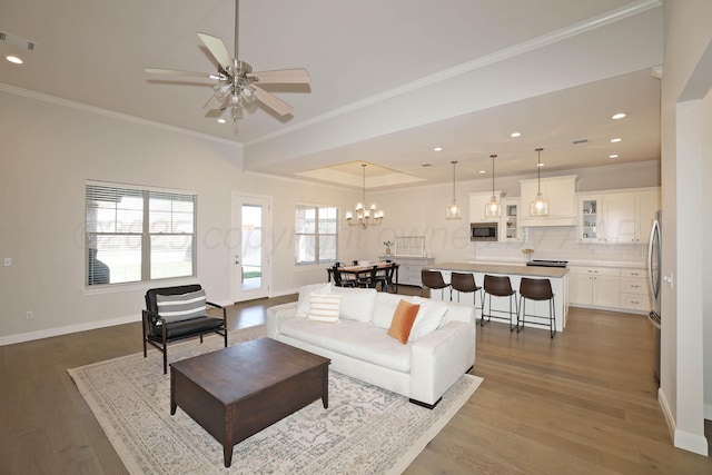 6107 Bowery, Amarillo, TX 79119 - living room with wood finished floors, baseboards, crown molding, ceiling fan, and recessed lighting