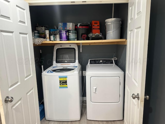 clothes washing area featuring washing machine and clothes dryer