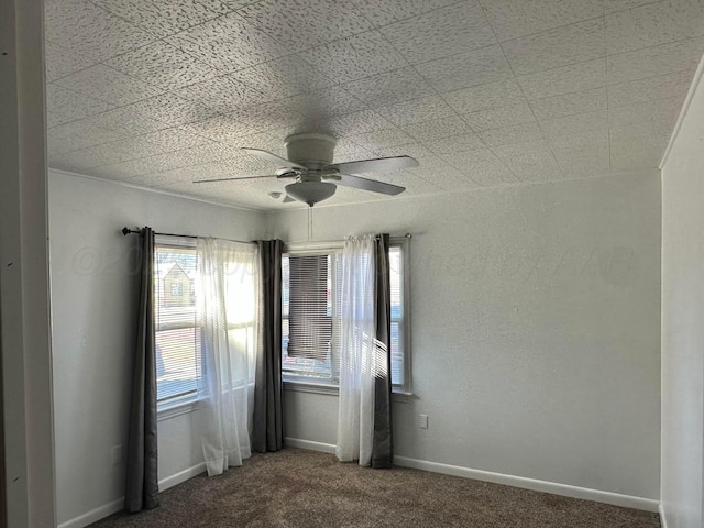 unfurnished room with carpet floors and ceiling fan