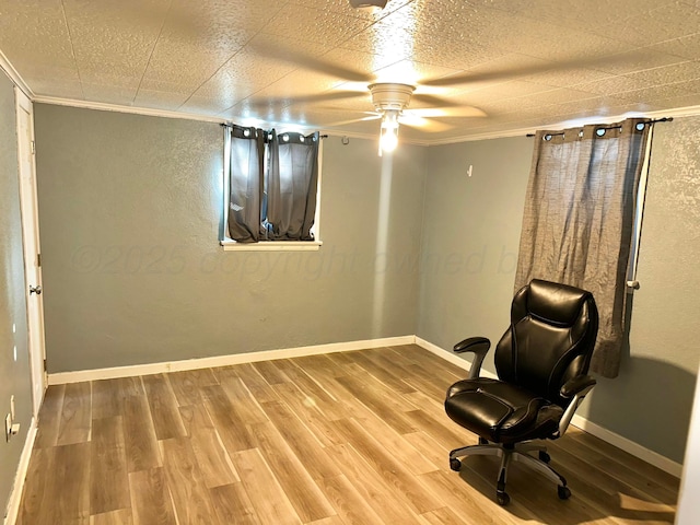 unfurnished room with ornamental molding, hardwood / wood-style floors, and ceiling fan