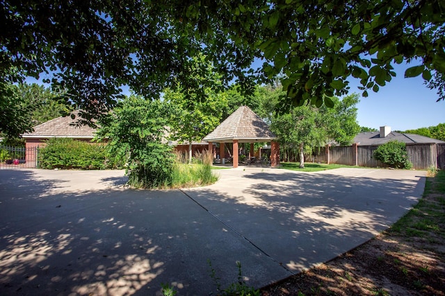 18 Cloister Pkwy, Amarillo, TX 79121 - view of property hidden behind natural elements featuring a gazebo