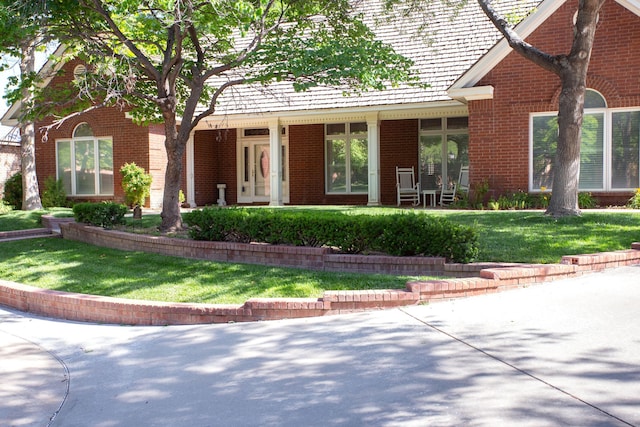 18 Cloister Pkwy, Amarillo, TX 79121 - view of front of home with brick siding and a front yard