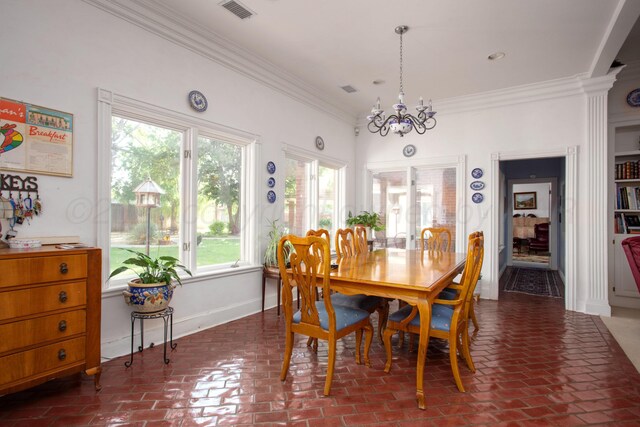 18 Cloister Pkwy, Amarillo, TX 79121 - dining area featuring ornamental molding, a chandelier, and brick flooring