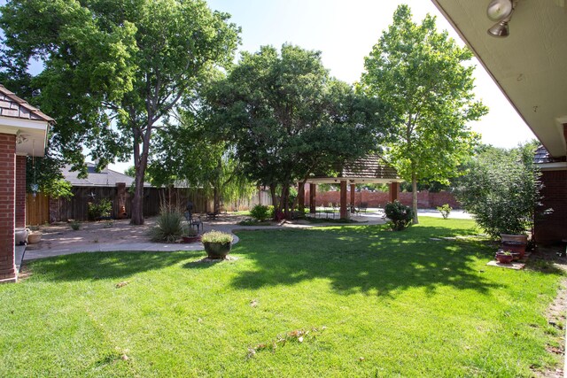 18 Cloister Pkwy, Amarillo, TX 79121 - fenced backyard with a gazebo and a patio