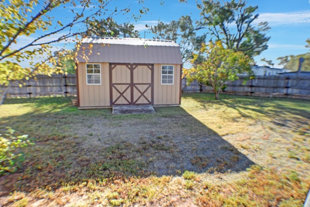 view of outdoor structure with a lawn