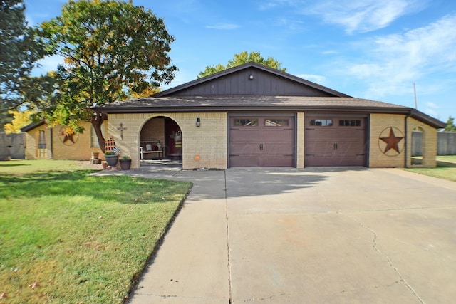 view of front of house with a garage and a front yard