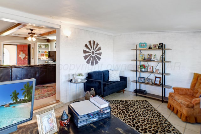 tiled living room with ceiling fan