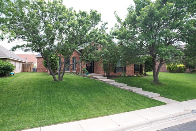 6903 Silverbell Ln, Amarillo, TX 79124 - view of property hidden behind natural elements featuring central AC and brick siding