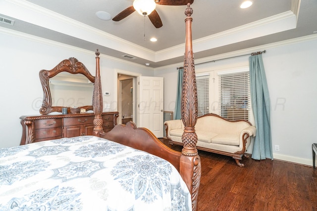 6903 Silverbell Ln, Amarillo, TX 79124 - bedroom featuring dark wood-type flooring, a raised ceiling, baseboards, a ceiling fan, and crown molding