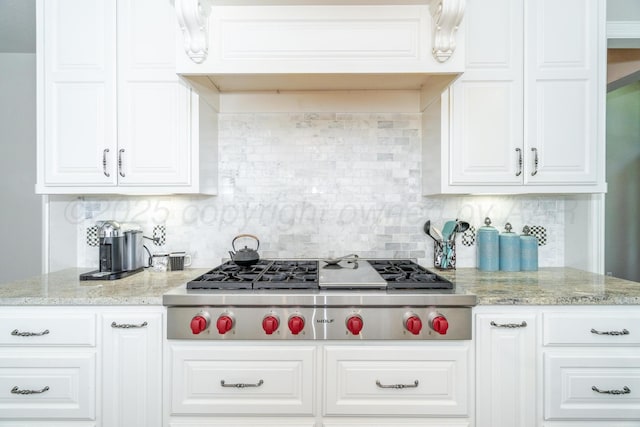 6903 Silverbell Ln, Amarillo, TX 79124 - kitchen featuring stainless steel gas stovetop, white cabinets, and decorative backsplash