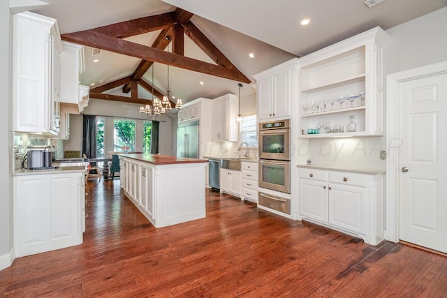 6903 Silverbell Ln, Amarillo, TX 79124 - kitchen featuring stainless steel appliances, a warming drawer, a chandelier, white cabinetry, and backsplash
