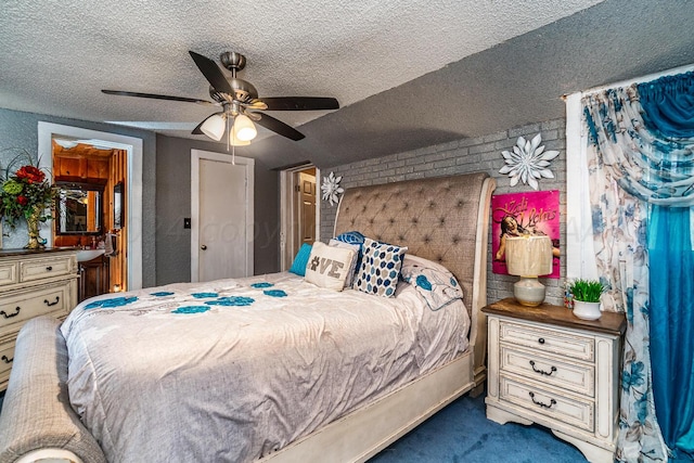 carpeted bedroom featuring a textured ceiling and ceiling fan