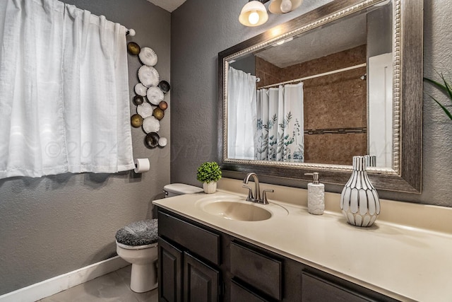 bathroom featuring a shower with shower curtain, tile patterned flooring, vanity, and toilet