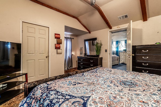 bedroom featuring lofted ceiling with beams