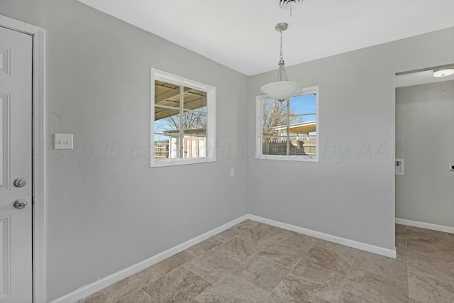 unfurnished dining area featuring a healthy amount of sunlight