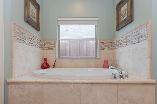 bathroom featuring tiled tub