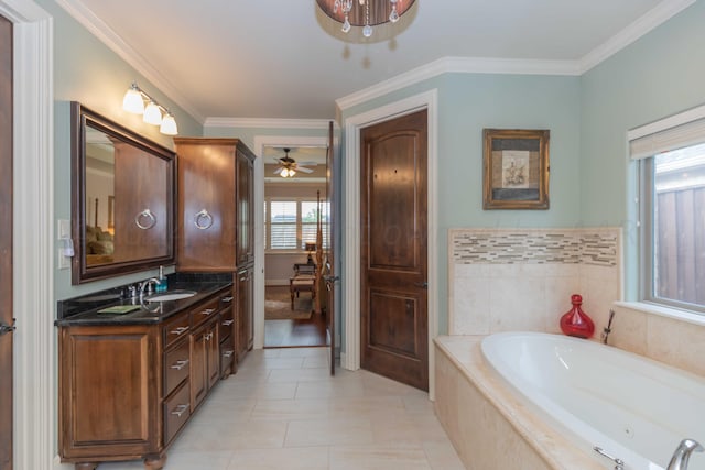 bathroom featuring tiled tub, ornamental molding, and plenty of natural light