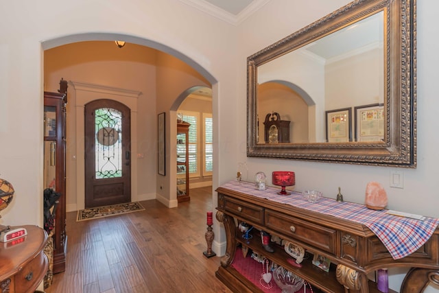 entryway featuring wood-type flooring and ornamental molding