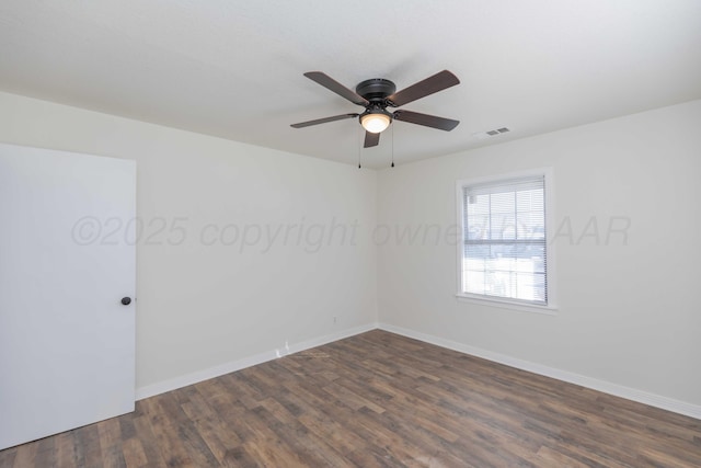 unfurnished room featuring dark wood-type flooring and ceiling fan