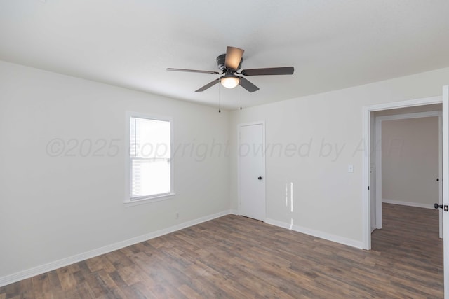 unfurnished room featuring ceiling fan and dark hardwood / wood-style flooring