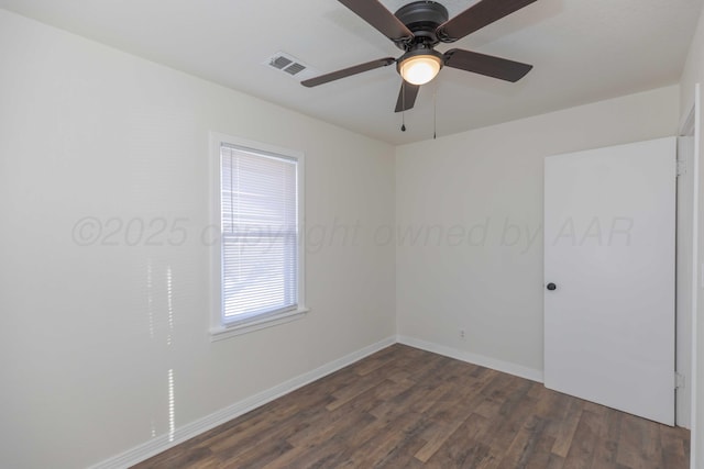 unfurnished room with dark hardwood / wood-style floors