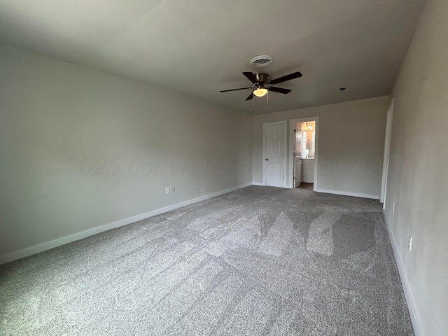 1223 Keeler Ave, Dalhart, TX 79022 - spare room with baseboards, a ceiling fan, dark carpet, and visible vents
