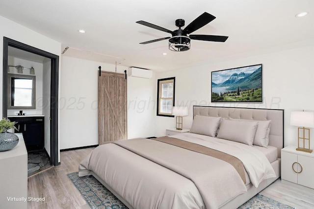 1802 Chama St, Amarillo, TX 79102 - bedroom with light wood finished floors, recessed lighting, a wall mounted air conditioner, and a ceiling fan