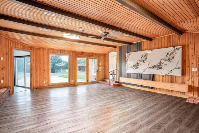 1802 Chama St, Amarillo, TX 79102 - unfurnished living room with wood walls, wood finished floors, a wooden ceiling with exposed beams, and a ceiling fan