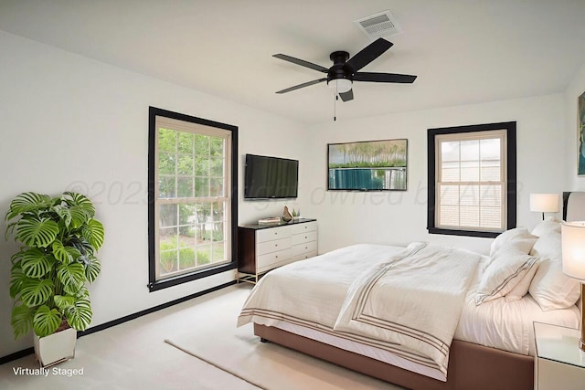 1802 Chama St, Amarillo, TX 79102 - carpeted bedroom with ceiling fan and baseboards