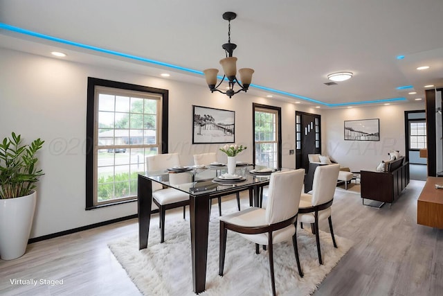 1802 Chama St, Amarillo, TX 79102 - dining room featuring light wood finished floors, plenty of natural light, recessed lighting, and a chandelier