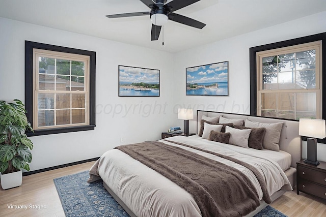 1802 Chama St, Amarillo, TX 79102 - bedroom featuring light wood finished floors, multiple windows, and a ceiling fan